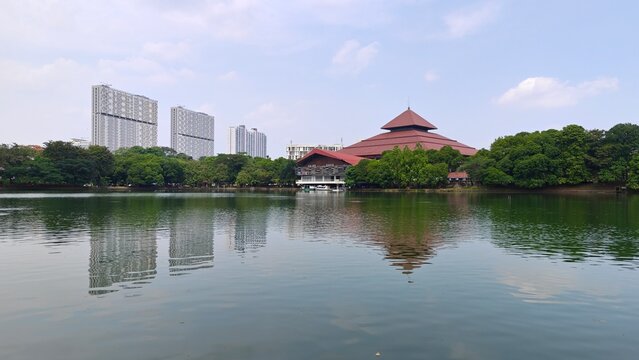 Indonesian University building and its reflection in the lake