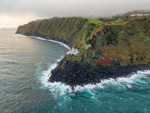 Aerial view of the Arnel Lighthouse over the Atlantic Ocean, Sao Miguel, Azores