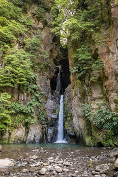Salto do Prego Waterfall in Lush Green Forest Canyon, Azores