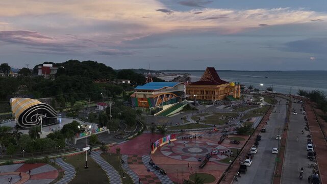 Aerial view of Tugu Daun Sirih Emas monument and the waterfront park at dusk in Tanjung Pinang, Kepulauan Riau, Indonesia.