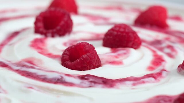 Fresh raspberry on creamy yogurt surface macro minimal composition, copy space