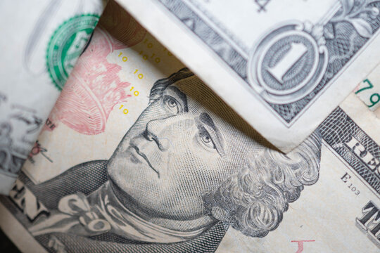 CASH Macro detailed texture, dollar bill nominations. Selective focus background image, finances, spending, inflation theme.