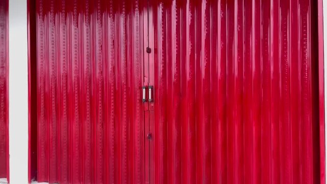 Close up texture of red corrugated metal rolling door