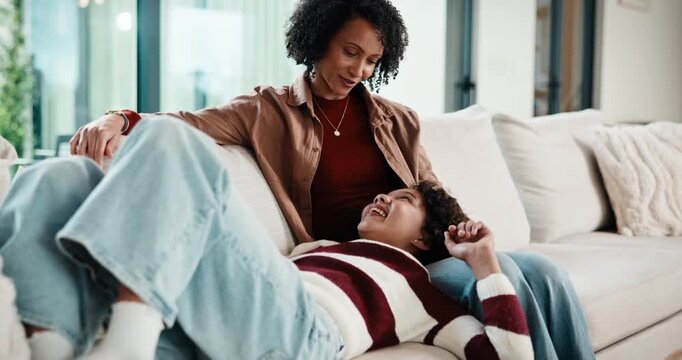 Mother, daughter and relax on couch with conversation, bonding together and laugh for funny gossip. Happy, mom and child chill in house with discussion, joke and family connection on weekend break.
