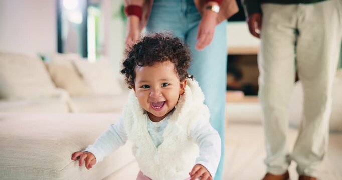 Face, baby and learning to walk at house for first steps, balance support and proud moment. Portrait, parents and people with toddler for mobility, teaching coordination and milestone encouragement