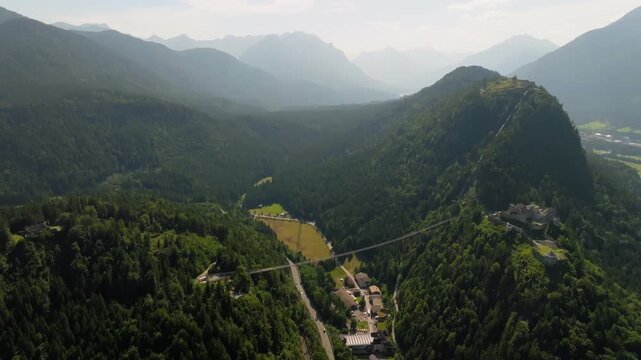 Highline 179 bridge and Ehrenberg Castle aerial view with alpine valley and mountains in Austria scenic travel destination