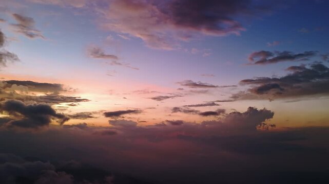 Aerial view of dramatic sunset clouds over the Dieng plateau landscape in Kejajar, Central Java, Indonesia.