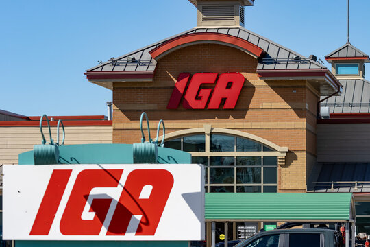 Quebec, Canada, 26 April 2026 : The IGA supermarket logo is displayed on the building facade and on an outdoor sign.