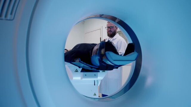 Patient seen inside circular MRI scanner tunnel during medical scan, showing high-tech radiology diagnostics and clinical examination process.
