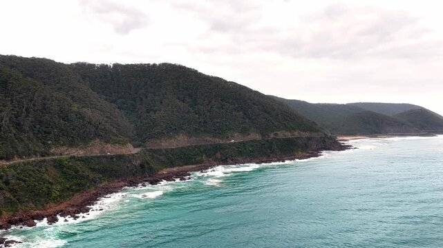 Bus left to right aerial scenic panorama over Great Ocean road in Victoria, Australia.