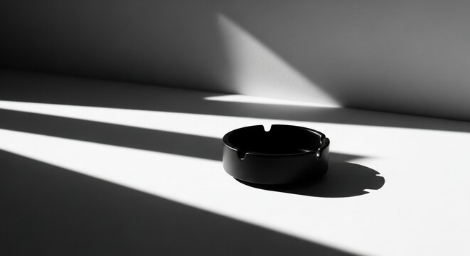 Black ashtray shadows white background