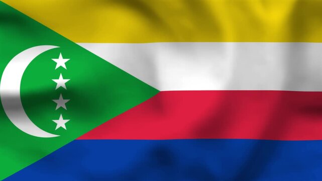 National flag of the Comoros on wavy cloth. Features four stripes and a green triangle with a white crescent and four stars. Professional top-down view for island news and national events.