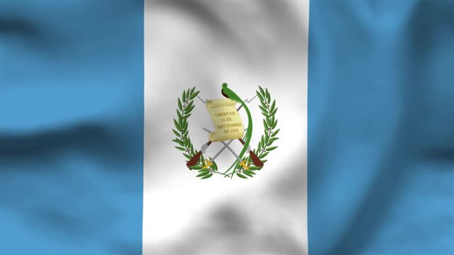 National flag of Guatemala on wavy cloth. Features sky blue and white vertical bars with the quetzal emblem. Professional top-down shot for Central American themes and holidays