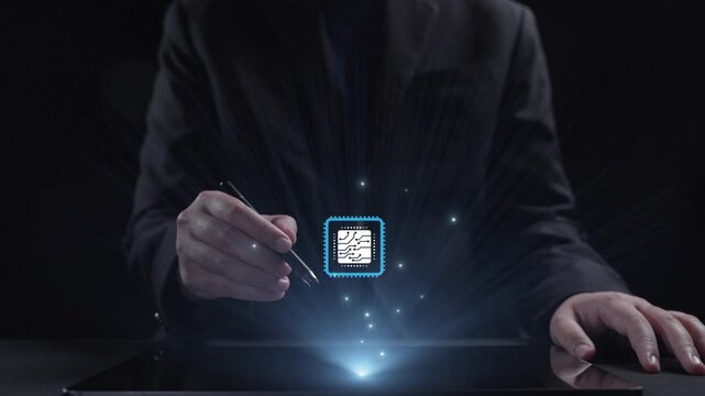 A man engages with a digital tablet, using a pen to navigate through a network of circuit patterns and a central microchip. The dark background enhances the futuristic technology theme. Qubit