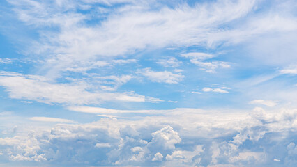Fototapeta premium Sky filled with various clouds during daylight near the ocean in a clear blue atmosphere