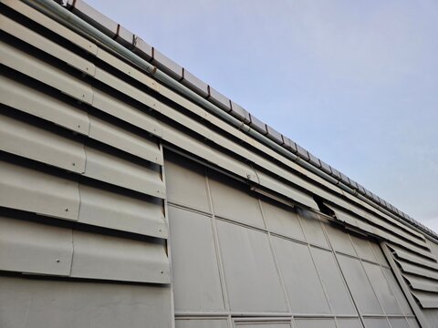 Low Angle View of Industrial Building Metal Facade with Louvers
