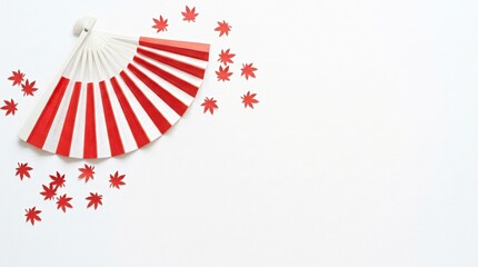 Obraz premium Folding fan with red and white stripes and scattered maple leaves, Canada Day celebration, minimalist festive background for seasonal holiday greeting cards