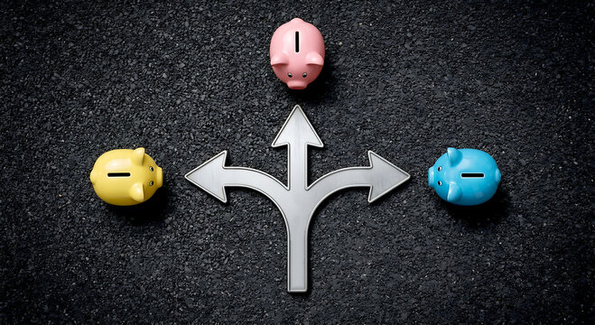 Three colorful piggy banks with splitting arrow on dark background conceptualizing financial decisions, asset allocation, investment options, and diversifying savings