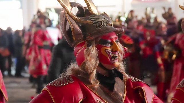 Viareggio, Italy - February 15, 2026: Nighttime masquerade parade on Viareggio seafront celebrating traditional Carnival with colorful costumes