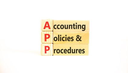 Naklejka premium APP accounting policies and procedures symbol. Concept words APP accounting policies and procedures on beautiful wooden blocks. Beautiful white background. Business APP concept. Copy space.