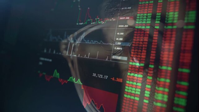 Close up reflection on glasses of a trader monitoring financial index and bearish red stock market charts.