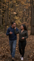 Fototapeta premium Two people walking outside in Autumn 