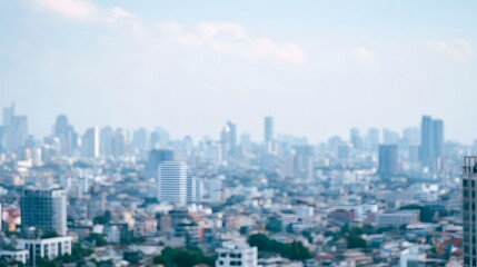 Fototapeta premium A blurred cityscape background featuring modern architectural structures under bright daylight creating a peaceful and abstract urban atmosphere