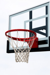 Naklejka premium Basketball hoop, net, and backboard up close with white background