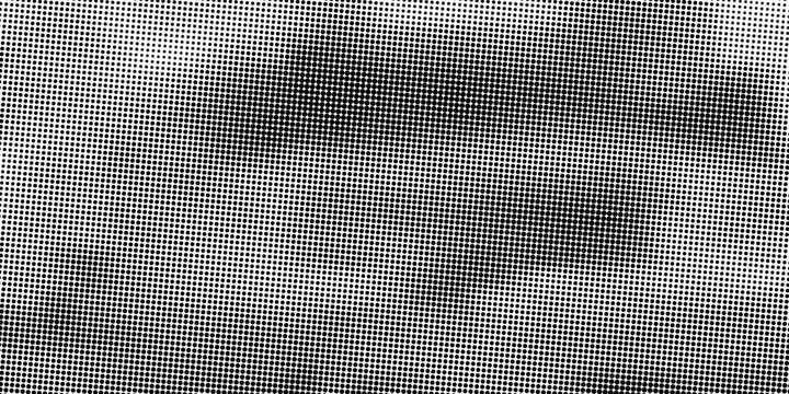 Abstract grayscale dotted texture with varying dot density creating a gradient effect from dark to light areas