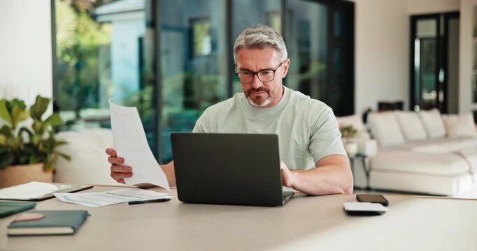 Mature, man and documents with laptop for finance, budget planning or checking expenses in home. Male person, computer and financial assessment with papers for investment, invoices or bills in house