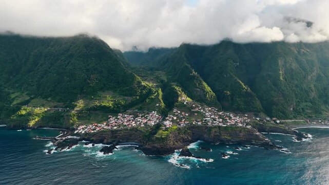 Aerial view of Seixal village on Madeira island, Portugal, with Atlantic Ocean and mountain landscape
