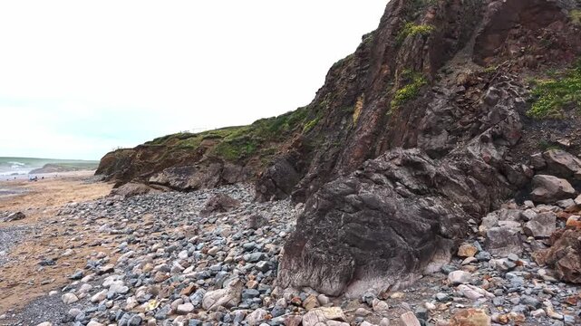 Rugged coastal cliffs on Widemouth Bay beach Cornwall