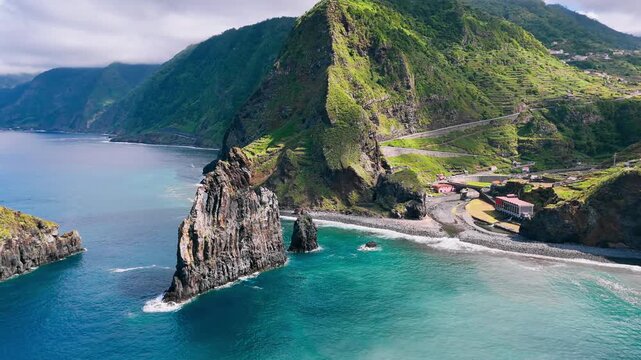 Coastal rock formations on Madeira, Portugal. Aerial footage of Atlantic shoreline with dramatic volcanic stacks and ocean waves
