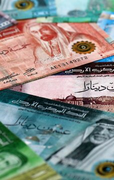 Jordanian dinar money bills pile on table. Jordan banknotes of JOD currency close up.