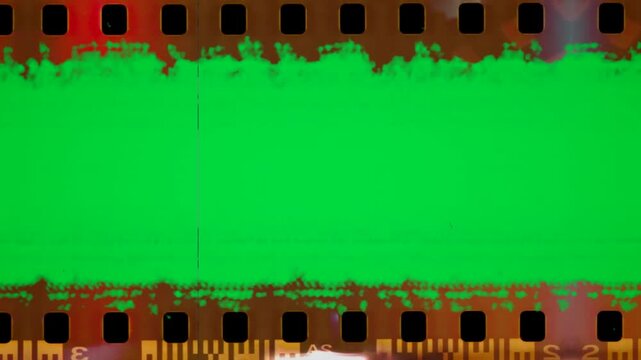 Damage film frame moving motion on green screen chroma key background. Extreme grunge dirt scratch fx overlay video template. hq director shot camera fx design sequence raw design work roll film