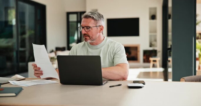 Mature, man and documents with laptop in home for finance, budget planning or checking expenses. Male person, computer and financial analysis with paperwork for investment, invoices or bills in house