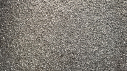 Fototapeta premium Rough gray textured surface, ideal for a minimalist desktop wallpaper.