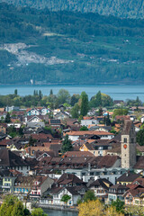 Fototapeta premium Panoramic view of Interlaken town with church tower and alpine landscape, Switzerland.