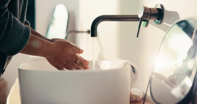 Health, washing hands or person in home with soap, bacteria removal or sanitation in wellness routine. Safety, clean or man with disinfectant, germ protection or hygiene habit in virus prevention.