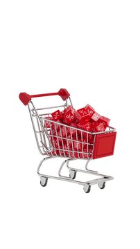 4k Resolution Vertical Video for Social Media: Shopping And Discount Concept. Shopping Cart Symbolizing Sale And Promotion Filled With Falling Red Percent Cubes On White Background With Alpha Matte