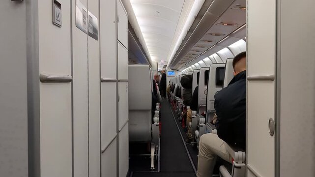 Aircraft seating corridor walkway, seated passengers