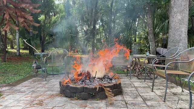 Burning yard waste in a fire pit in the backyard