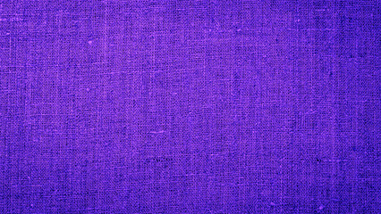 Fototapeta premium Purple fabric texture shows its detailed weave and strong color in bright light during the day for textile design use