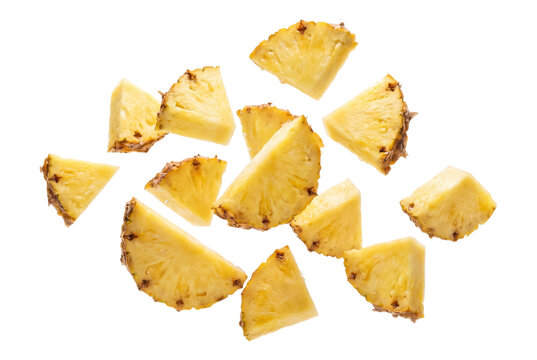 Sliced pineapple pieces arranged randomly on transparent background