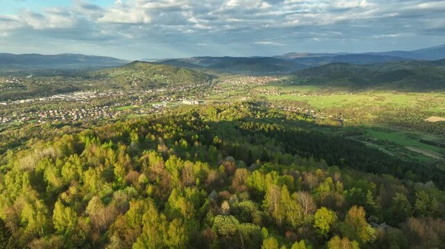 Drone Flying Over Spring Trees Towards Zywiec Town