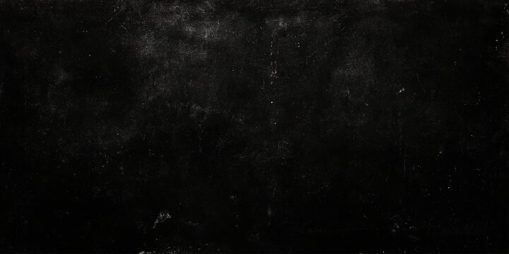 Dark textured surface with scratches and marks on a worn black background