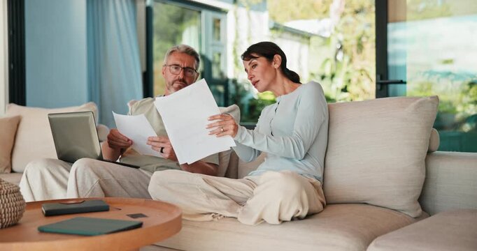 Couple, laptop or finance with documents on sofa for bills, expenses or investment in home. Man, woman or paperwork with computer for financial planning, budget cost or invoices together in house