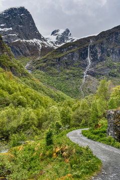 Hiking Trail to Briksdal Glacier in Olden Norway With Waterfalls and Snowy Mountains