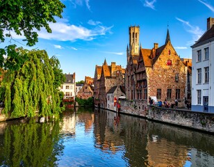Naklejka premium Historic Brick Houses Reflecting in Calm Canal Water in Sunny Bruges City Center