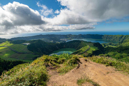 Panoramic landscape view of Sete Cidades volcanic crater lakes from a hiking trail in the Azores